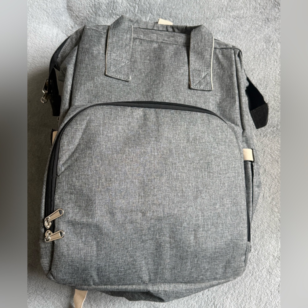 Gray Baby Backpack/Diaper Bag with fold out portable bassinet
